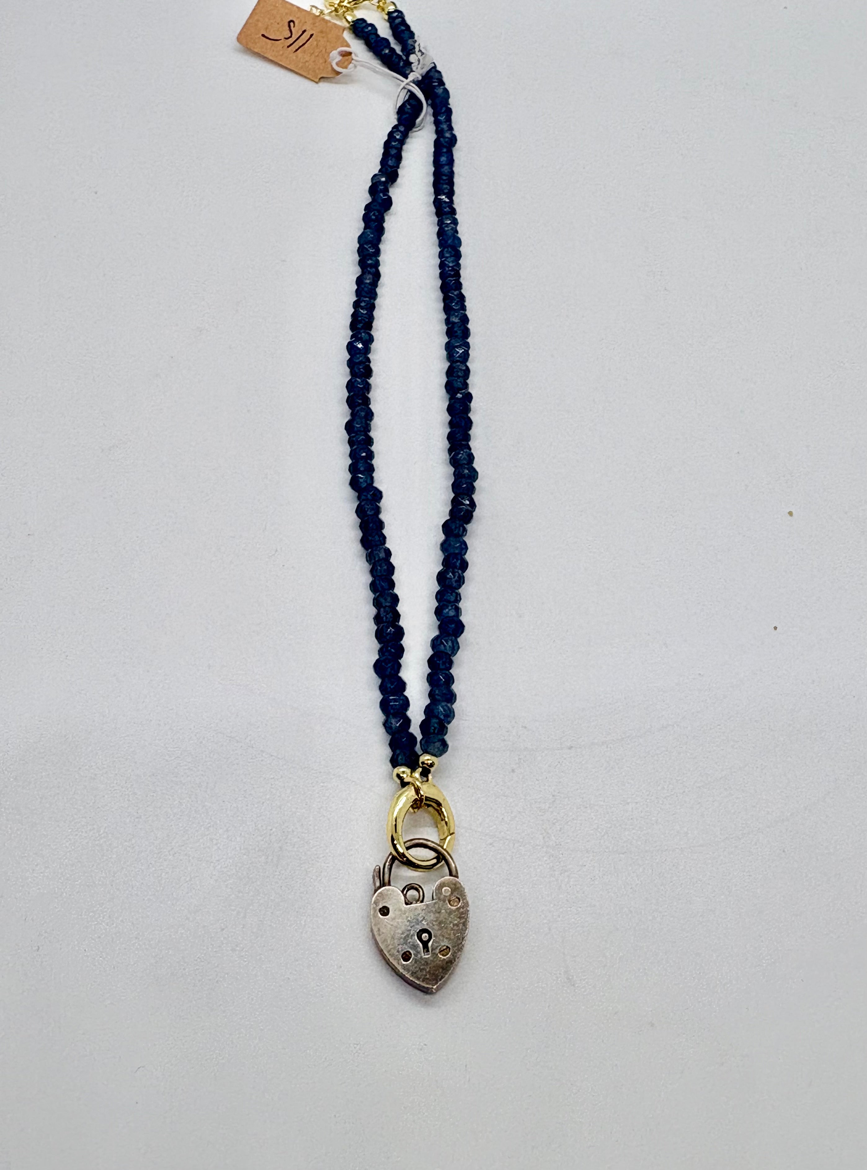 Vintage sterling heart lock on navy beaded necklace