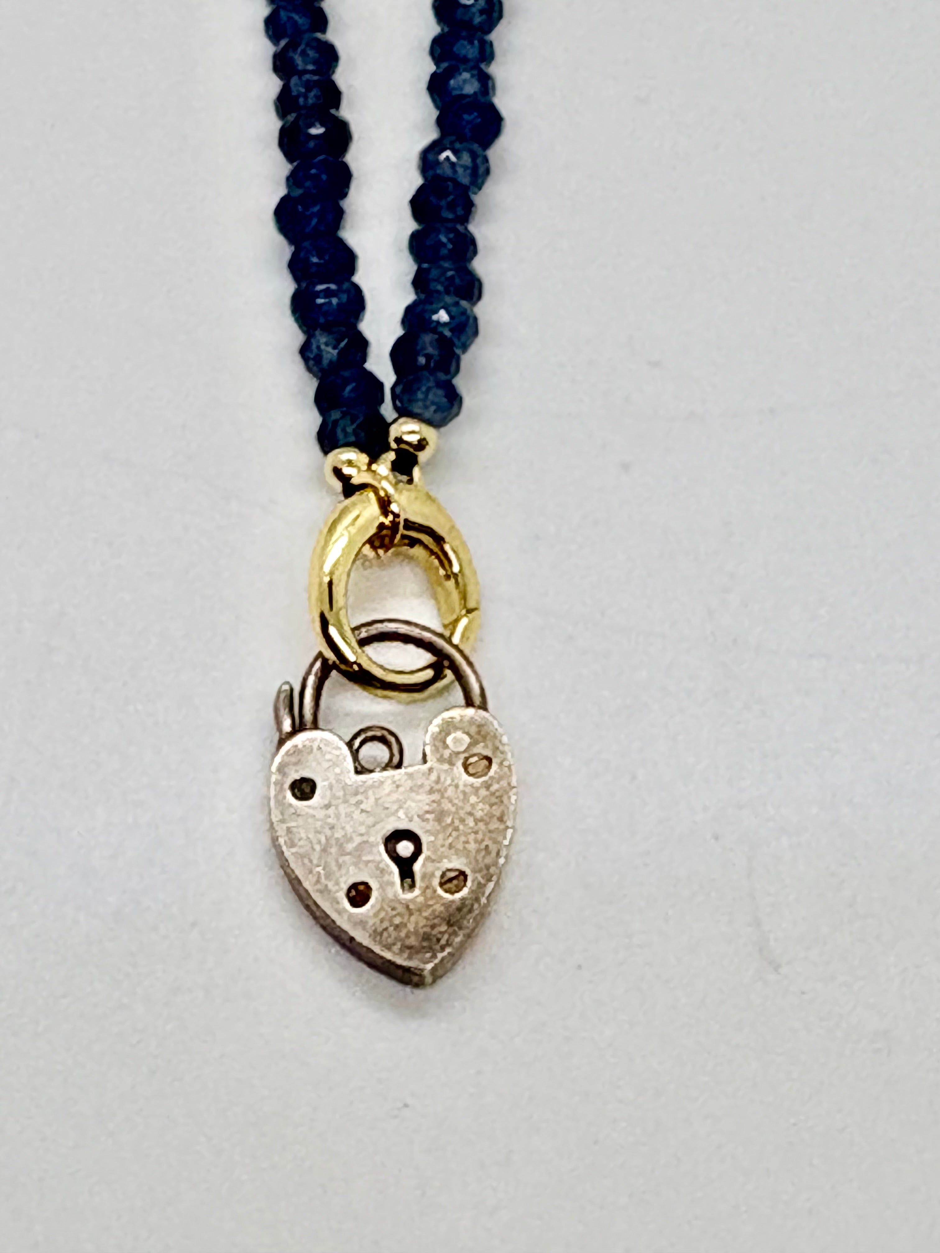 Vintage sterling heart lock on navy beaded necklace