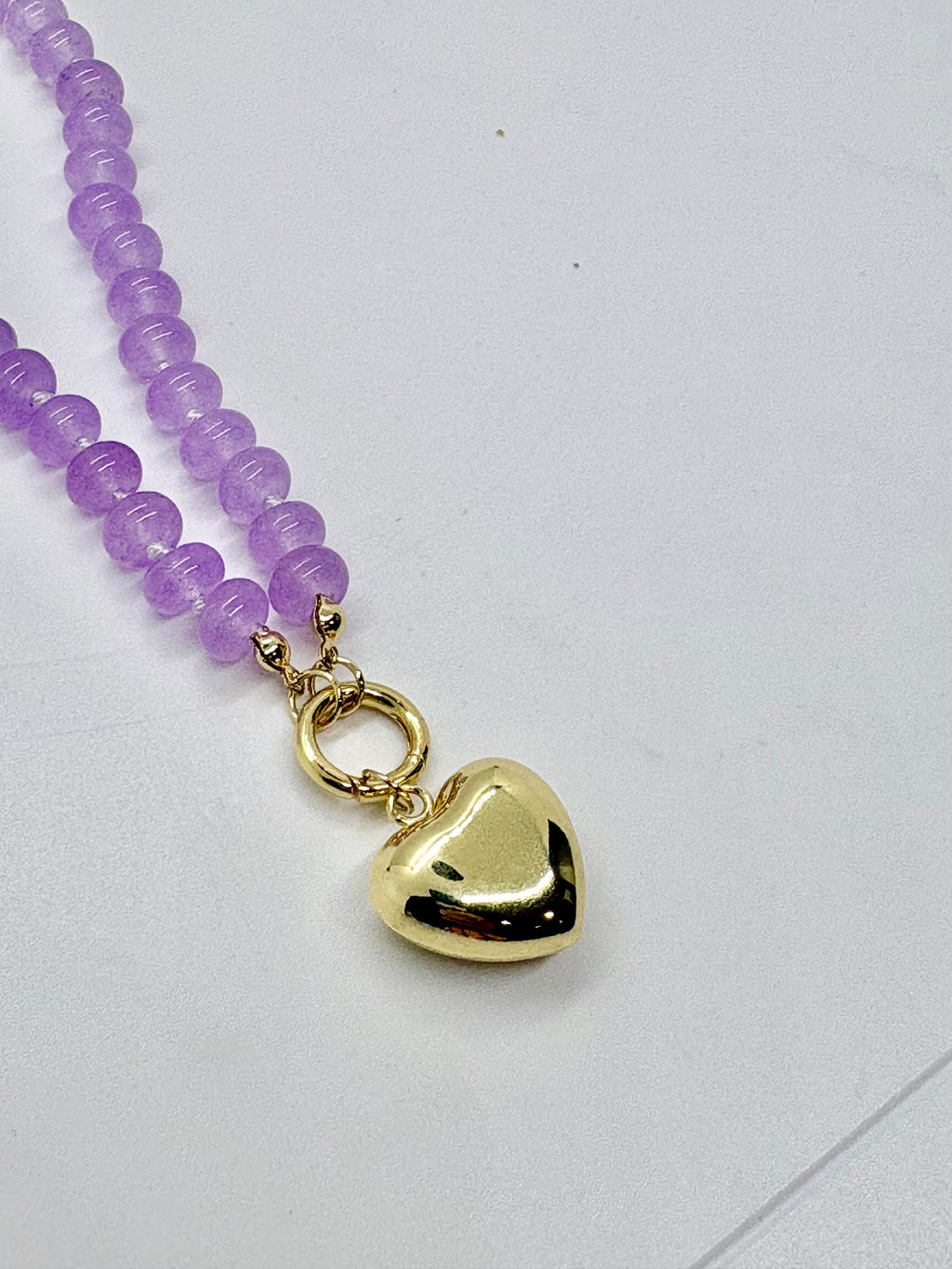 Beaded necklace with gold heart